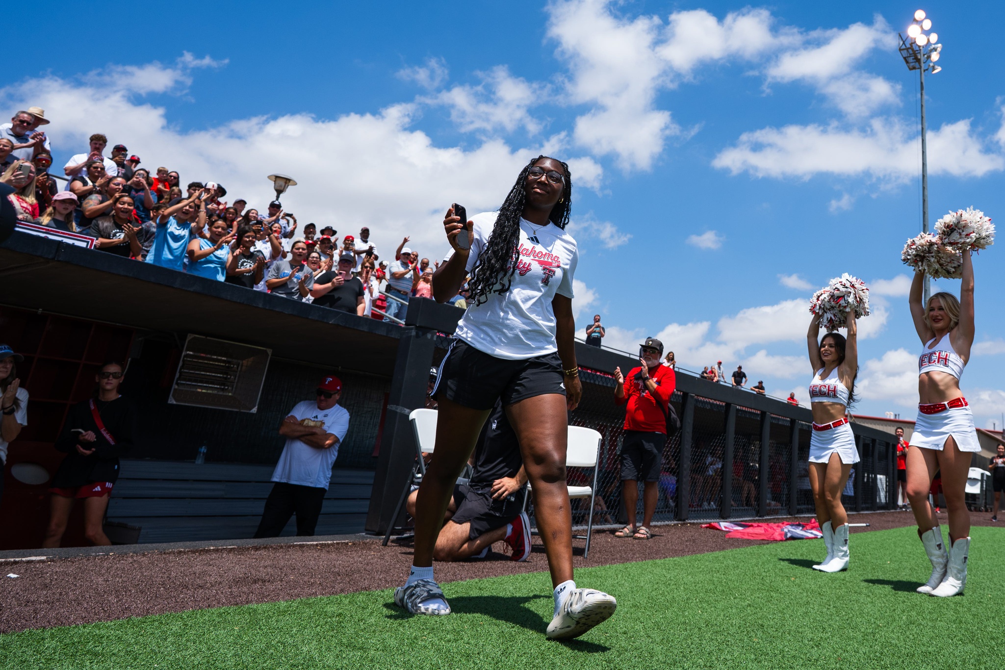 NiJaree Canady waves to fans during a welcome back event for the Red Raider softball team at Rocky Johnson Field in Lubbock, Texas, on Friday, June 7, 2025.