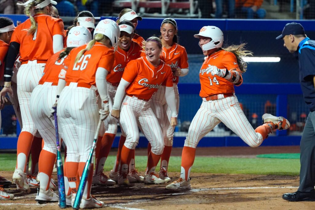 Oklahoma State Cowgirls infielder Karli Godwin (14) celebrates after hitting a home run in the third inning of a Bedlam softball game between the Oklahoma State Cowgirls and the Oklahoma Sooners at Devon Park in Oklahoma CIty, Wednesday, April 15, 2026. Oklahoma State won 6-4.