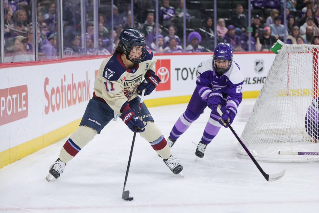 Montréal Victoire forward Abby Roque (11) skates with the puck while Minnesota Frost defenseman Mae Batherson (21) defends during the Montréal Victoire versus Minnesota Frost game three Walter Cup first round game.