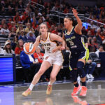 Caitlin Clark #22 of the Indiana Fever brings the ball up the court against Azzi Fudd #35 of the Dallas Wings during the preseason game at Gainbridge Fieldhouse on April 30, 2026 in Indianapolis, Indiana.