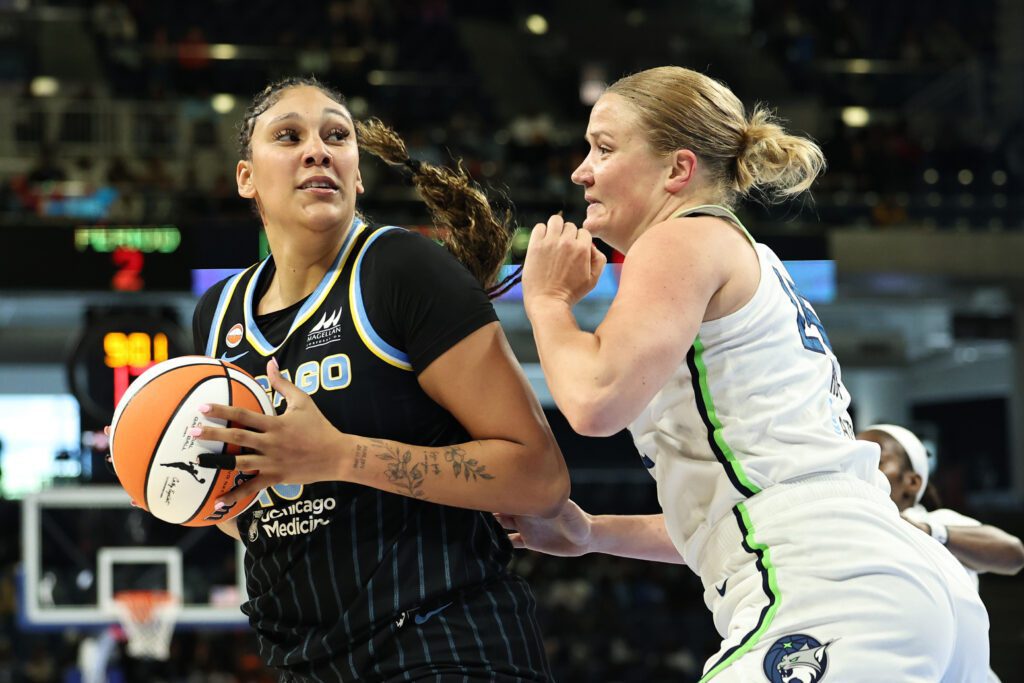 Kamilla Cardoso #10 of the Chicago Sky drives past Emese Hof #25 of the Minnesota Lynx during the first half at Wintrust Arena on May 23, 2026 in Chicago.