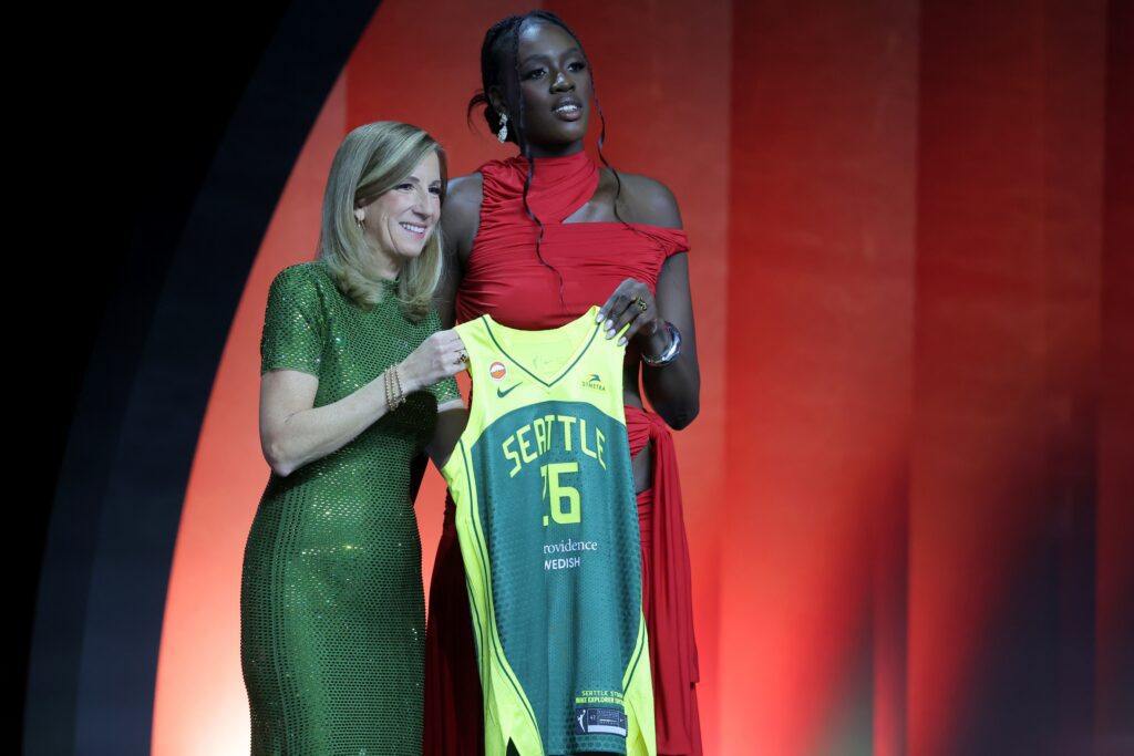 WNBA rookie temporary suspension subject Awa Fam poses with WNBA Commissioner Cathy Engelbert after being selected third overall by the Seattle Storm during the 2026 WNBA Draft at The Shed at Hudson Yards.