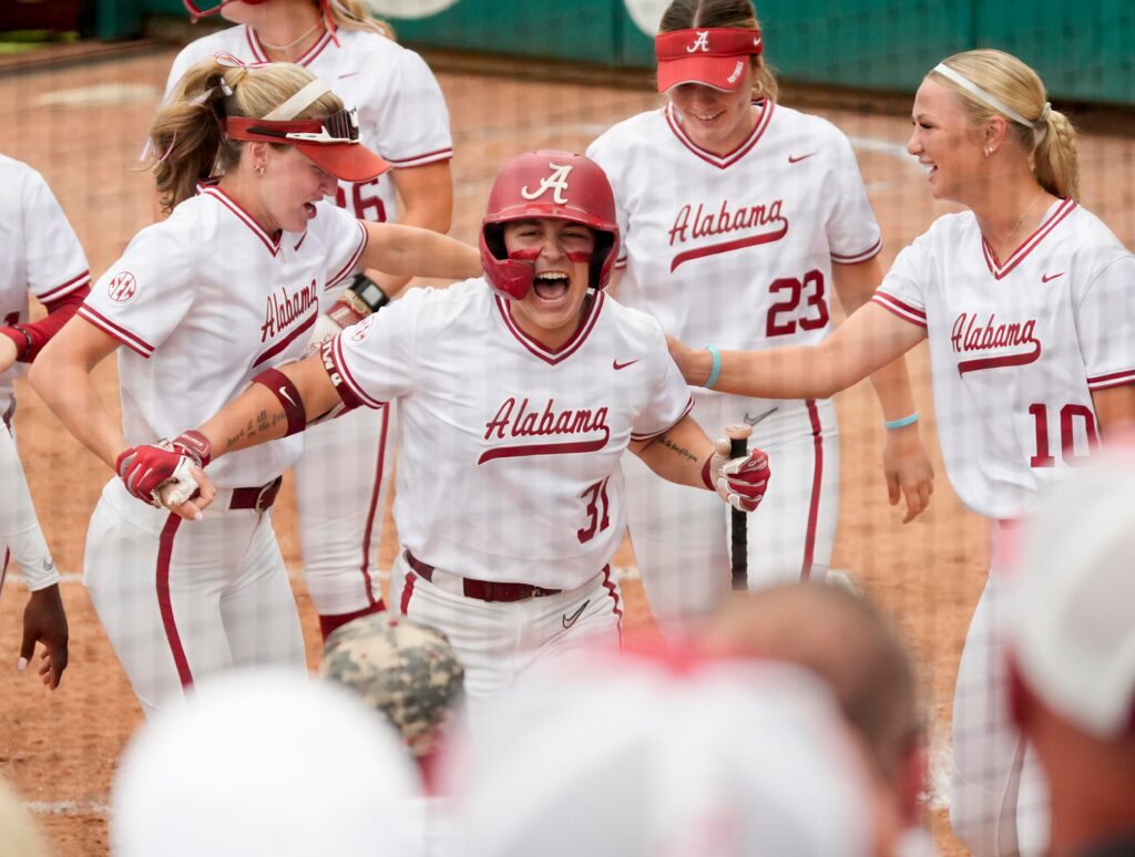 SEC softball tournament contender Alabama batter Alexis Pupillo celebrates her two-run homer in game 2 of the weekend series at Rhoads Stadium as the Crimson Tide hosted Kentucky.