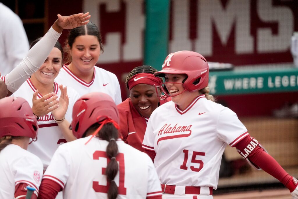 Alabama batter Brooke Wells reaches the plate after hitting a two-run homer at Rhoads Stadium as the Crimson Tide hosted South Carolina.