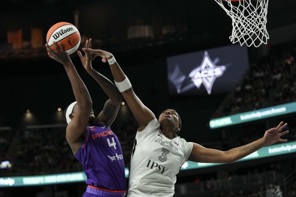 Phoenix Mercury forward Natasha Mack (4) shoots against Las Vegas Aces forward Nalyssa Smith (3) in the first quarter of their WNBA game at T-Mobile Arena.