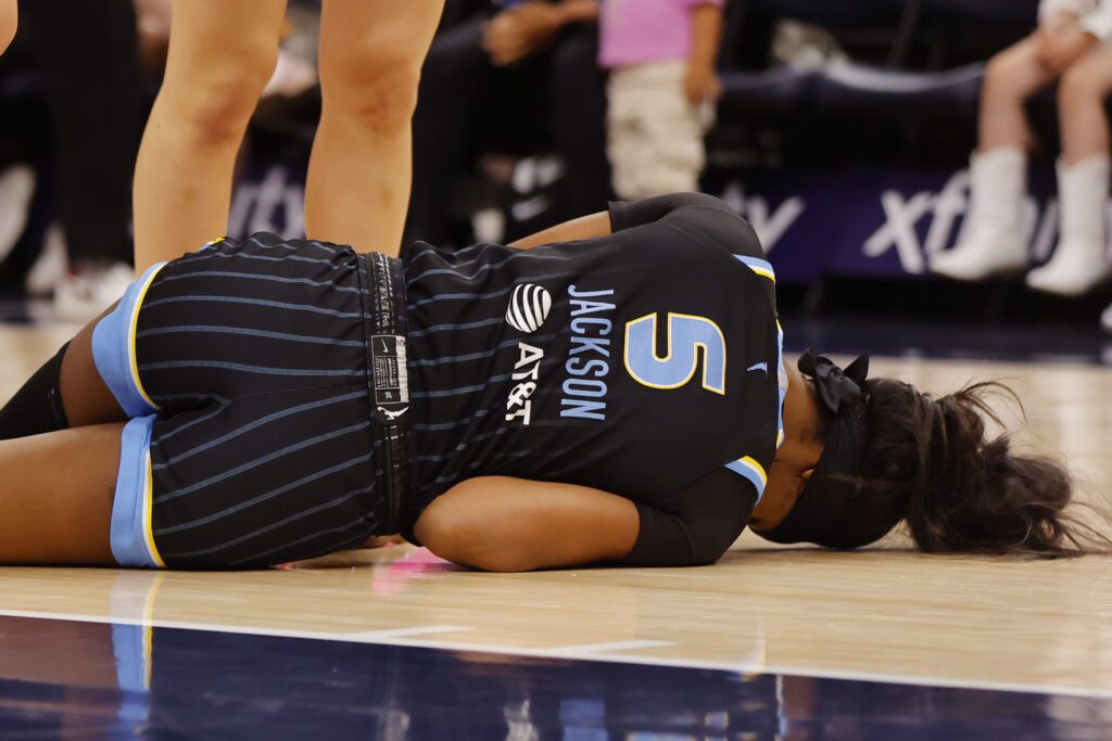 Chicago Sky forward Rickea Jackson (5) lays on the floor after an injury against the Minnesota Lynx in the second quarter at Target Center.