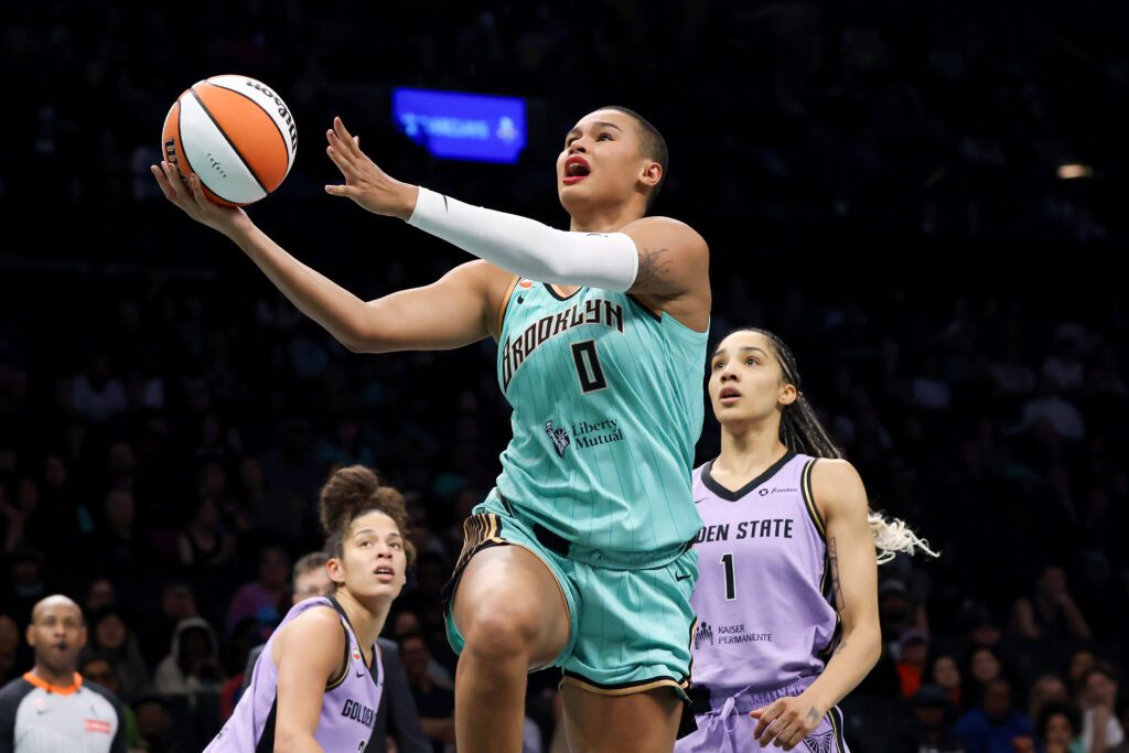 New York Liberty forward Satou Sabally (0) drives to the basket against Golden State Valkyries forward Gabby Williams (1) during the second half at Barclays Center.