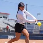 UAB Birmingham softball coach Taylor Smartt hits a softball at home plate before abuse and misconduct allegations.
