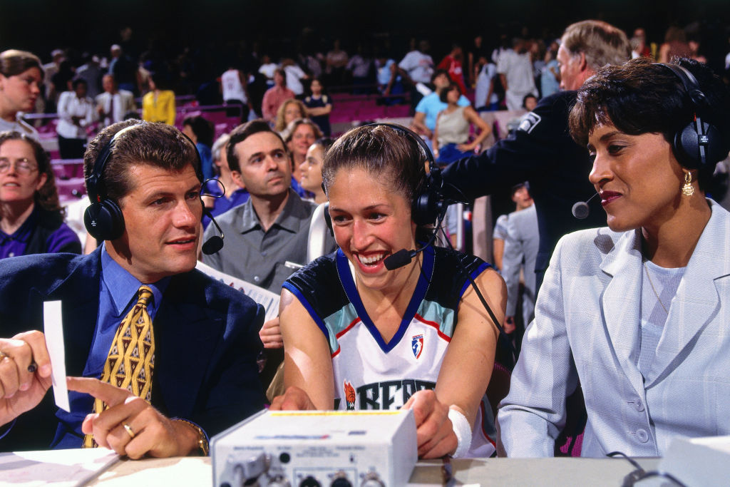 Early WNBA ESPN commentators Geno Auriemma and Robin Roberts speak to Rebecca Lobo #50 of the New York Liberty after the game against the Charlotte Sting on July 10, 1997 at Madison Square Garden in New York, New York.