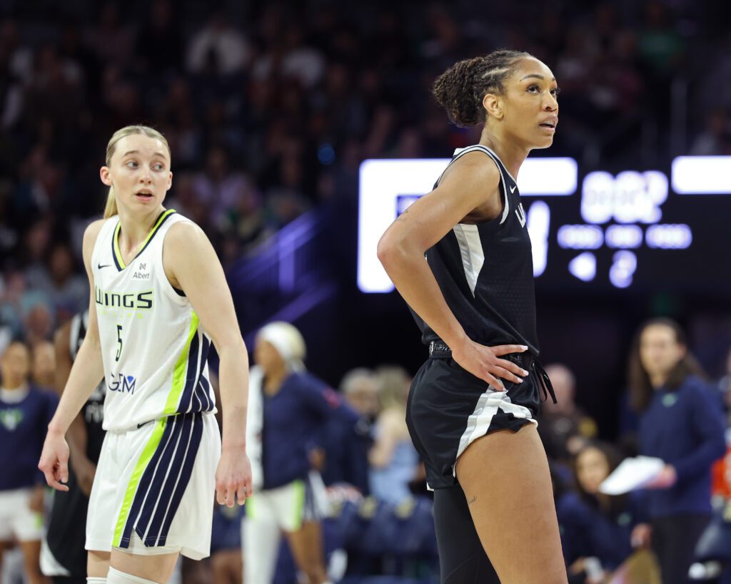 A'ja Wilson #22 of the Las Vegas Aces and Paige Bueckers #5 of the Dallas Wings look on during the game during the WNBA Preseason Game.
