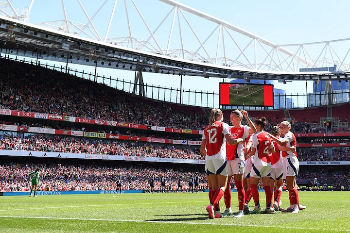 Frida Maanum of Arsenal celebrates with teammate Steph Catley after scoring her team's third goal during the Barclays Women's Super League match between Arsenal FC and Manchester United FC at Emirates Stadium on May 10, 2025 in London, England head of the WSL x Airbnb player housing deal.