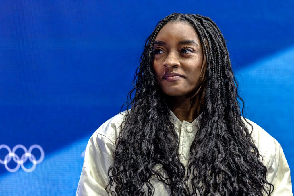 Simone Biles of the United States during an interview rinkside, at the Figure Skating, Men's Singles Skating-Free Skating competition at the Milano Ice Skating Arena at the Milano Cortina Winter Olympic Games 2026.
