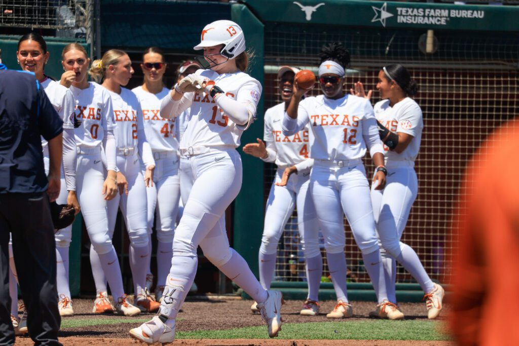 Texas Longhorns infielder Hannah Wells #13 celebrates after hitting a two run home run during the SEC college softball game between Texas Longhorns and Arkansas Razorbacks.