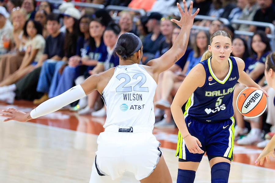 Dallas Wings guard Paige Bueckers #5 dribbles past Las Vegas Aces center A'ja Wilson #22 during the game on May 03, 2026, at the Moody Center in Austin, TX.