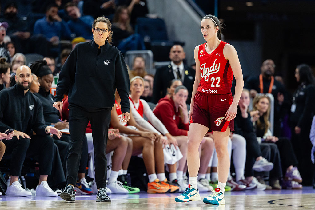 Head coach Stephanie White and Caitlin Clark #22 of the Indiana Fever watch on during a game against the Golden State Valkyries on May 28, 2026 at Chase Center in San Francisco, CA ahead of sideline fight.