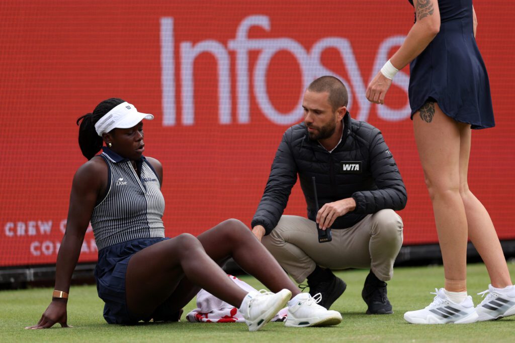 Canada's Victoria Mboko reacts after slipping on the grass attempting to play a return shot against Czech Republic's Karolina Pliskova during their round of 16 women's singles match at the HSBC WTA tennis Championships at Queen's Club.