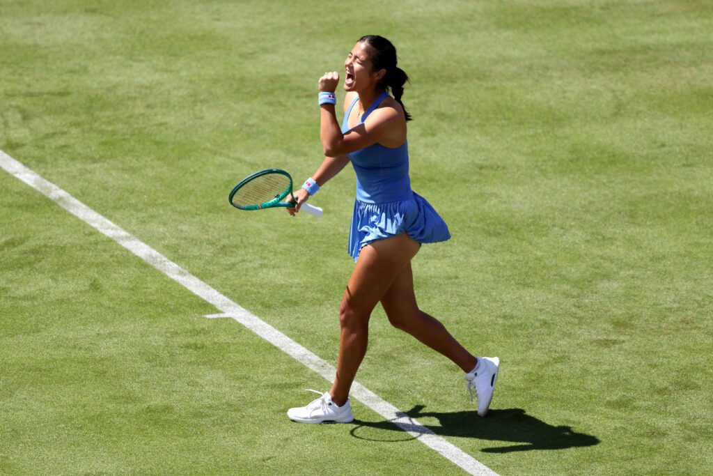 Emma Raducanu of Great Britain celebrates winning match point against Anna Blinkova during the Women's Singles first round match on Day Two of the HSBC Championships at The Queen's Club.