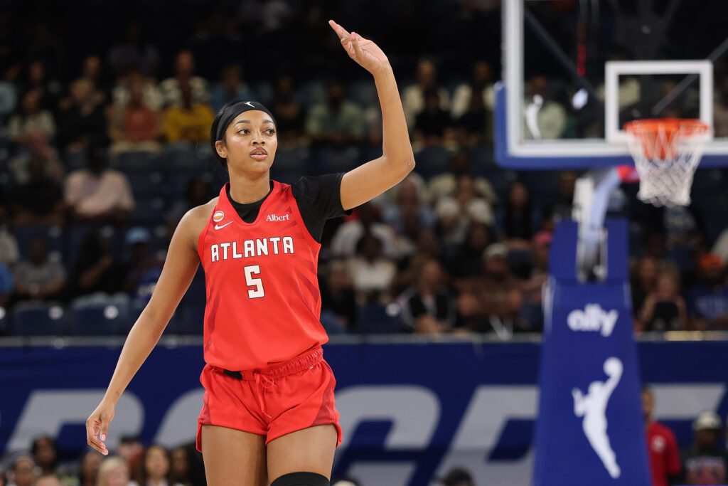 Angel Reese #5 of the Atlanta Dream celebrates a three pointer against the Chicago Sky during the first half at Wintrust Arena.