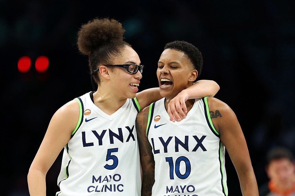 Olivia Miles #5 and Courtney Williams #10 of the Minnesota Lynx celebrate against the Dallas Wings in the second quarter at Target Center on June 09, 2026 in Minneapolis, Minnesota ahead of the Lynx vs Aces WNBA Commissioner's Cup game.