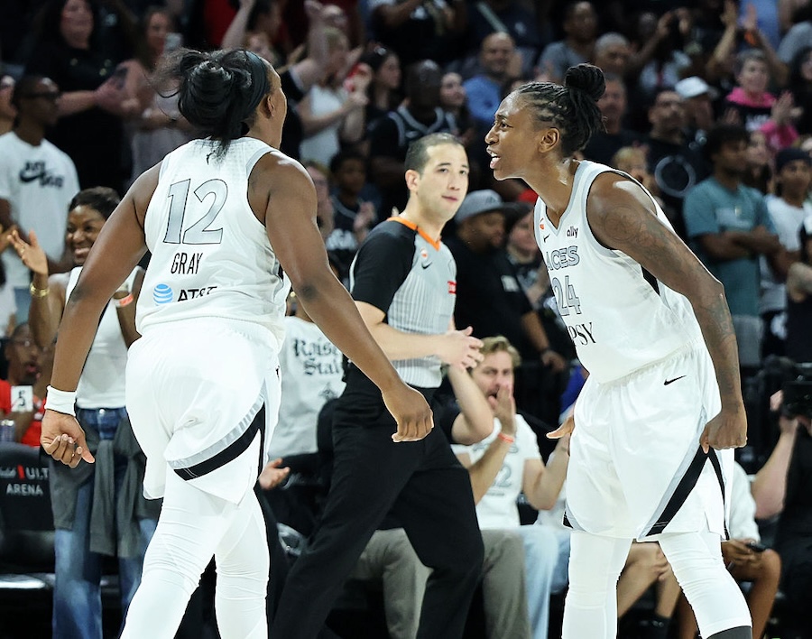 Chelsea Gray #12 and Jewell Loyd #24 of the Las Vegas Aces celebrate after Gray got a rebound and then drew a foul against the Minnesota Lynx late in the fourth quarter of their game at Michelob ULTRA Arena on June 13, 2026 in Las Vegas, Nevada. The Aces defeated the Lynx 100-97.