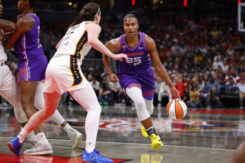 Phoenix Mercury forward Alyssa Thomas (25) drives towards the basket while defended by Indiana Fever guard Caitlin Clark (22) in the first half of play during a WNBA game between the Phoenix Mercury and the Indiana Fever on June 24, 2026 at Gainbridge Fieldhouse in Indianapolis.