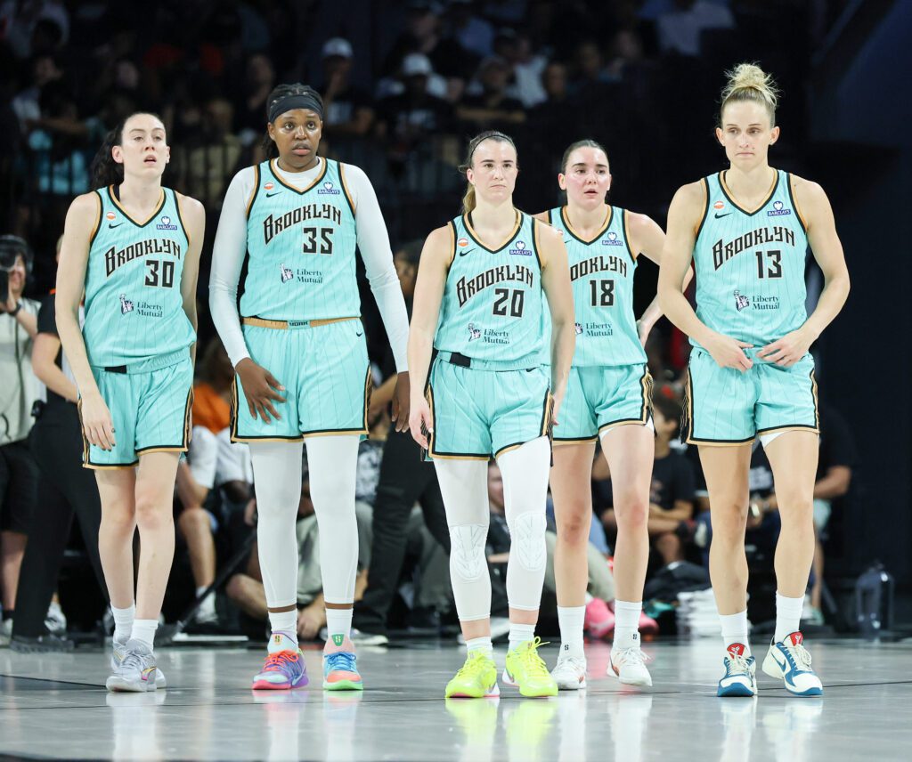 Breanna Stewart #30, Jonquel Jones #35, Sabrina Ionescu #20, Pauline Astier #18 and Leonie Fiebich #13 of the New York Liberty walk back on the court after a timeout in the second quarter of their game against the Las Vegas Aces.