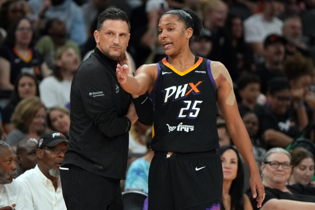 Phoenix Mercury forward Alyssa Thomas (25) talks to her had coach Nate Tibbetts after receiving a technical foul against the Atlanta Dream.