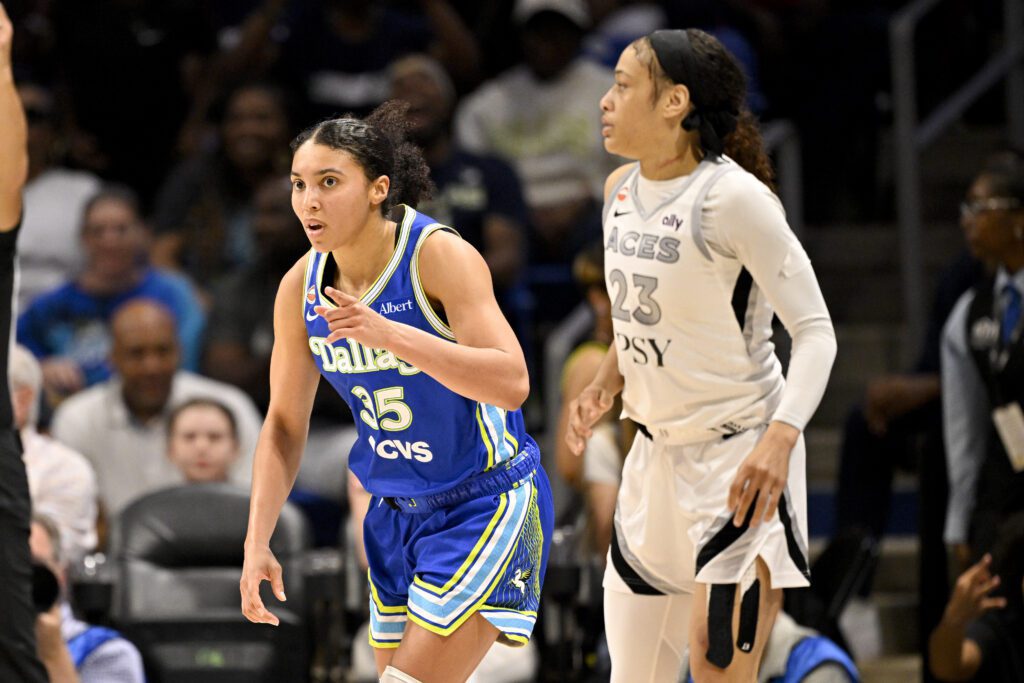Dallas Wings guard Azzi Fudd (35) celebrates as Las Vegas Aces guard Chennedy Carter (23) looks on during the second half at College Park Center.