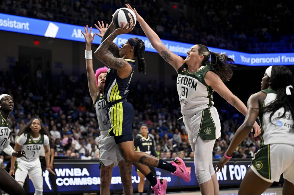 Seattle Storm center Stefanie Dolson (31) blocks a shot by Dallas Wings guard Aziaha James (10) during the second half at College Park Center during the 2026 WNBA Commissioner's Cup.