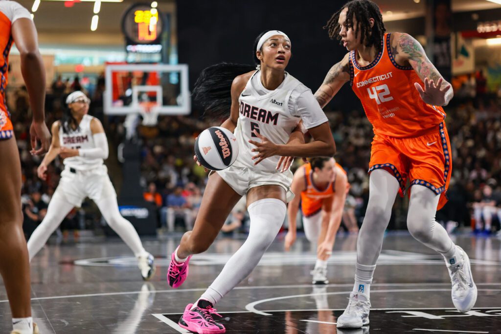 Atlanta Dream forward Angel Reese (5) drives on Connecticut Sun center Brittney Griner (42) in the second quarter at Gateway Center Arena.