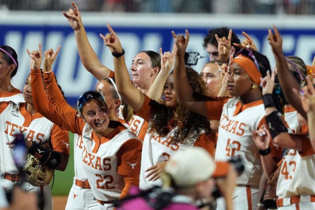 Texas Longhorns pitcher Teagan Kavan (17) celebrates with teammates after Game 1 of the NCAA softball Women's College World Series finals between the Texas Longhorns and the Texas Tech Red Raiders at Devon Park in Oklahoma City, Wednesday, June 3, 2026.