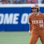 Texas Longhorns utility Reese Atwood (14) reacts at second base after hitting a double in the fourth inning against the Texas Tech Red Raiders during Game Two of the NCAA WomenÕs College World Series championship series at Devon Park.