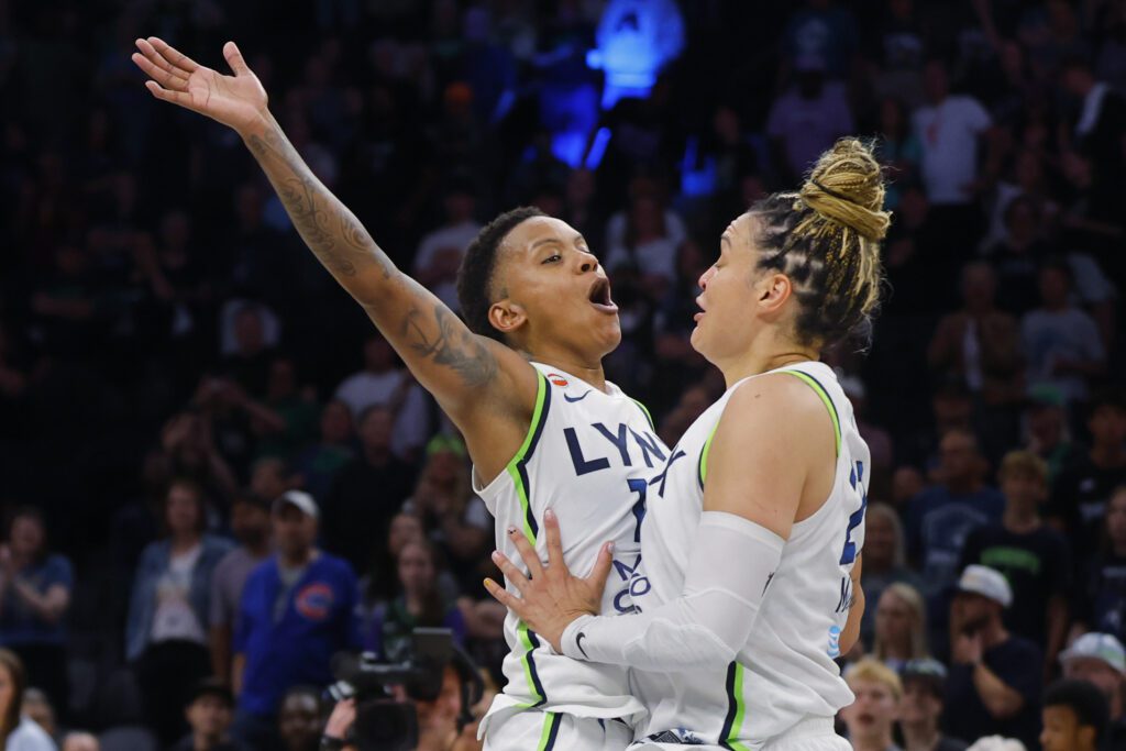 Minnesota Lynx guards Courtney Williams (10) and Kayla McBride (21) celebrate after defeating the Golden State Valkyries at Target Center.