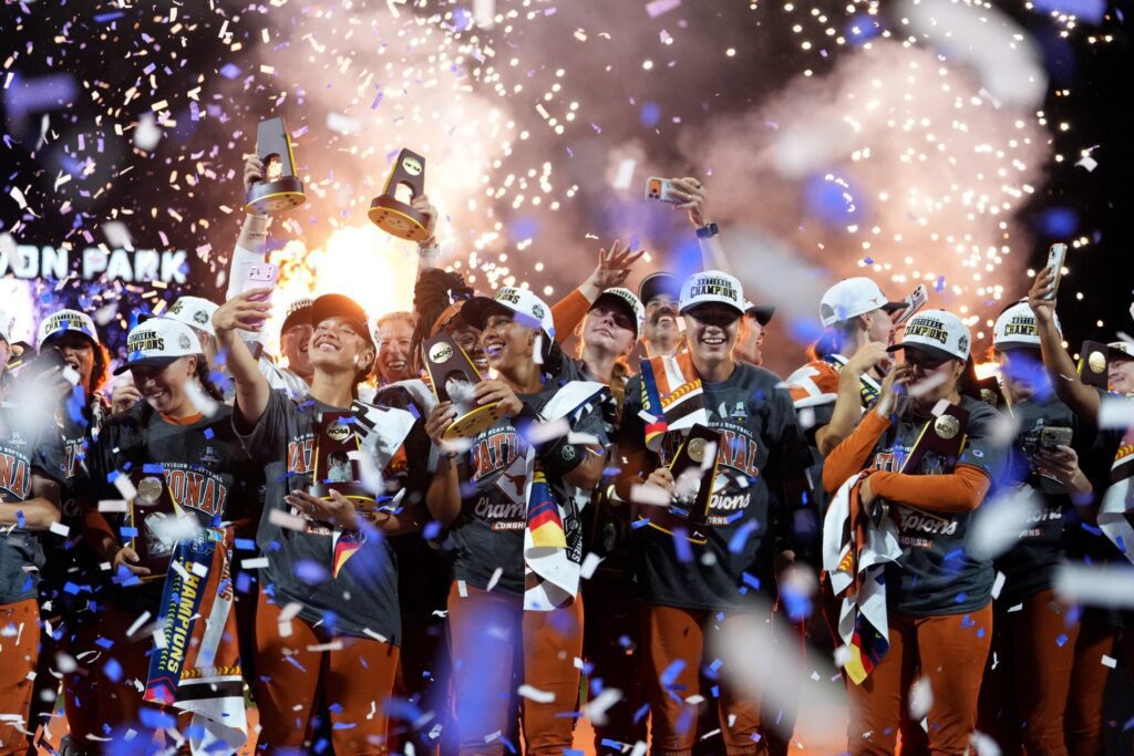 The Texas Longhorns celebrate after winning the NCAA softball Women's College World Series championship over the Texas Tech Red Raiders at Devon Park in Oklahoma City, June 4, 2026 to score record WCWS viewership.