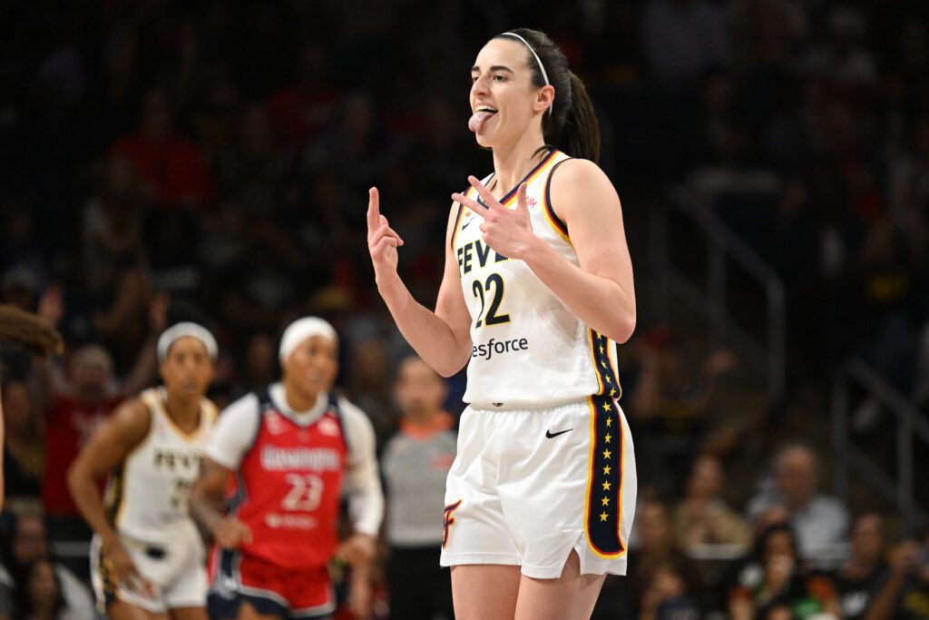 Indiana Fever guard Caitlin Clark (22) reacts after making a three-point basket against the Washington Mystics during the first quarter at CareFirst Arena.