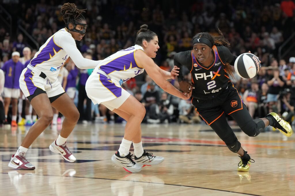 Phoenix Mercury guard-forward Kahleah Copper (2) drives past Los Angeles Sparks guard Kelsey Plum (10) and guard Ariel Atkins (7) in the second half at Mortgage Matchup Center.