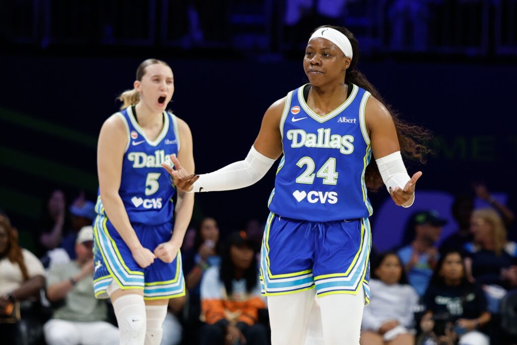 Dallas Wings guard Arike Ogunbowale (24) and guard Paige Bueckers (5) react after a play against the Las Vegas Aces during the first half at College Park Center.