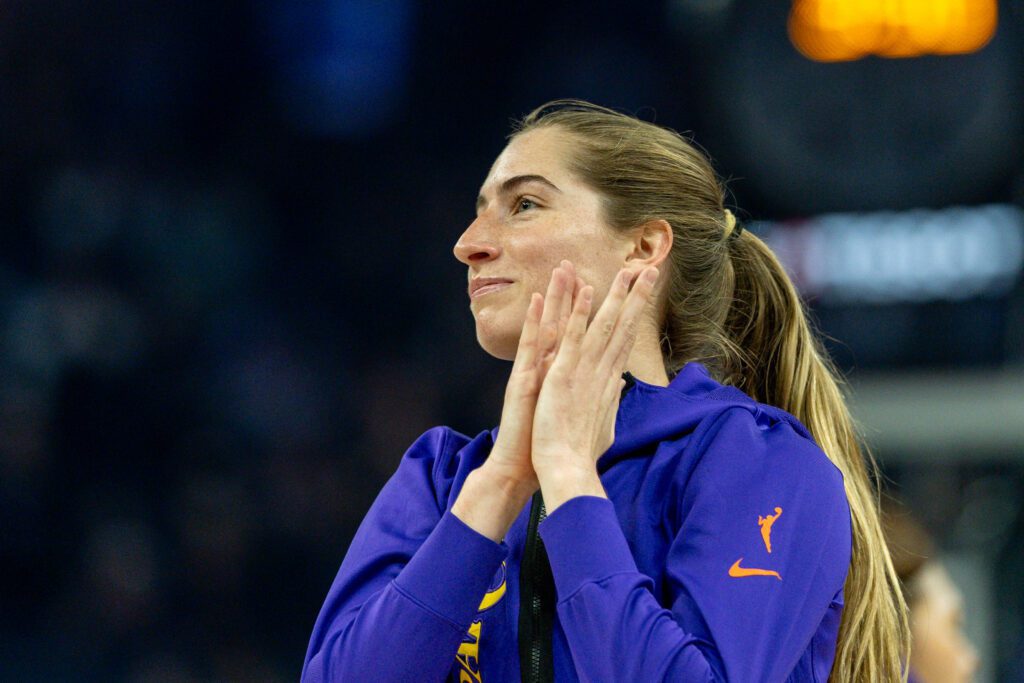 Los Angeles Sparks guard Kate Martin (21) thanks the crowd for her welcome before the game against the Golden State Valkyries in a Commissioner’s Cup game at Chase Center.