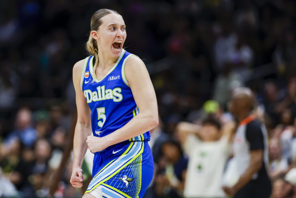 Dallas Wings guard Paige Bueckers (5) reacts after shooting a three-pointer against the Seattle Storm dduring the fourth quarter at Climate Pledge Arena.