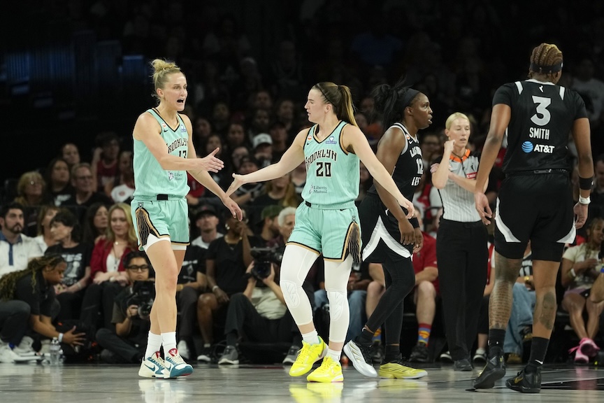 New York Liberty guard Sabrina Ionescu (20) celebrates with forward Leonie Fiebich (13) after scoring against the Las Vegas Aces during the second quarter of a WNBA basketball game at Michelob Ultra Arena.