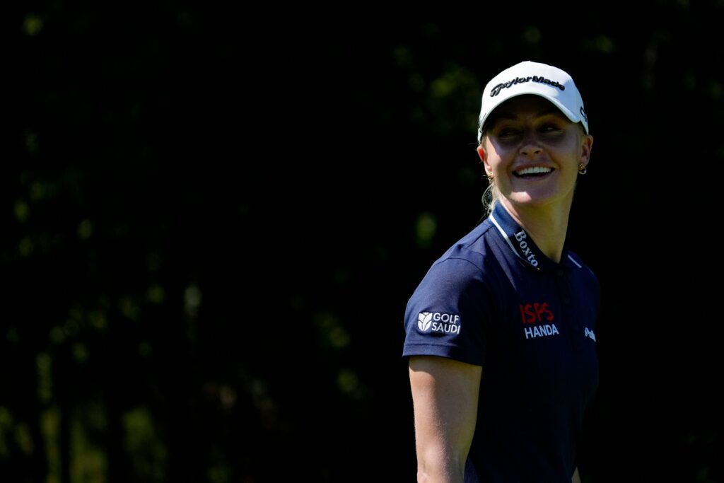 Charley Hull smiles to a fan cheering her name during the second round of the Kroger Queen City Championship at TPC River's Bend.