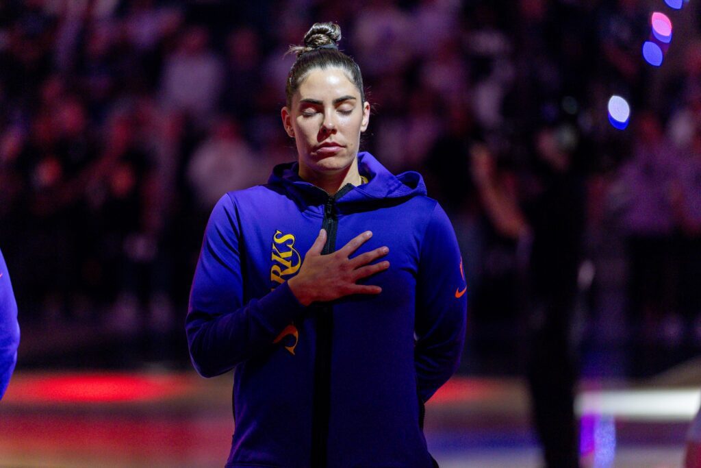 Los Angeles Sparks guard Kelsey Plum (10) listens to the National Anthem before the game against the Golden State Valkyries in a Commissioner’s Cup game at Chase Center.