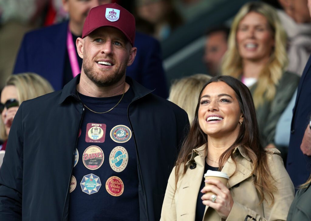 Burnley minority share holders JJ Watt and Kealia Watt applaud from the stands during the Sky Bet Championship match at Turf Moor, Burnley.