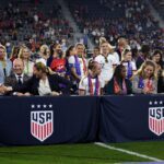 U.S. Soccer Federation CEO Will Wilson, U.S. Soccer Federation president Cindy Parlow Cone and Becky Sauerbrunn, Crystal Dunn, Sam Mewis of the USWNT talk during the signing of the collective bargaining agreement after a game between Nigeria and USWNT at Audi Field on September 6, 2022 in Washington, DC.