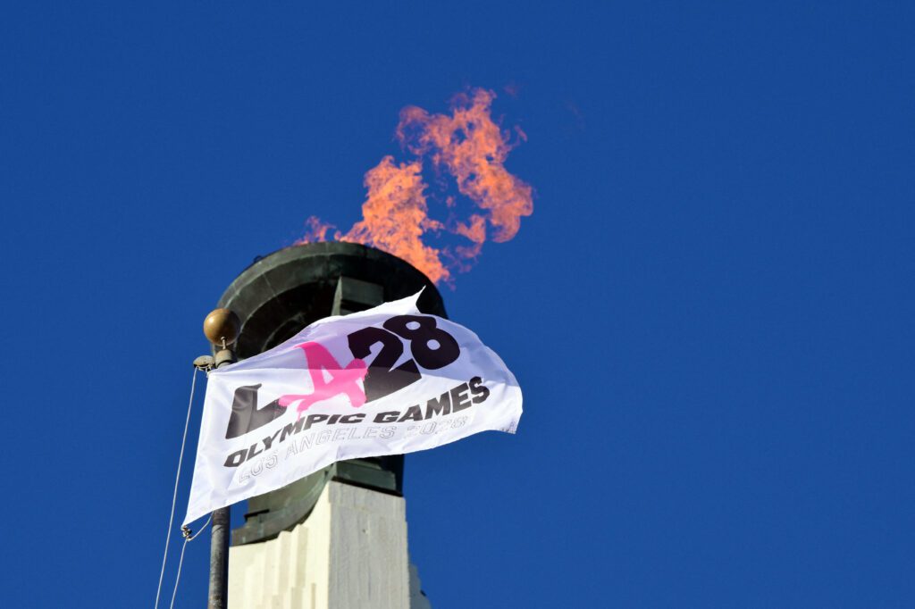 The LA28 Olympic cauldron is lit during a ceremonial lighting at the Memorial Coliseum in Los Angeles on January 13, 2026.