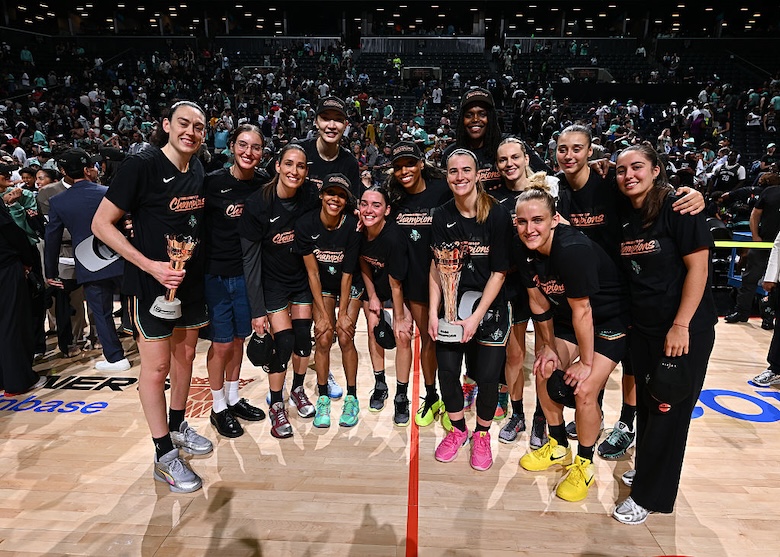The New York Liberty pose for a photo after winning the 2026 WNBA Commissioner's Cup Game against the Las Vegas Aces.