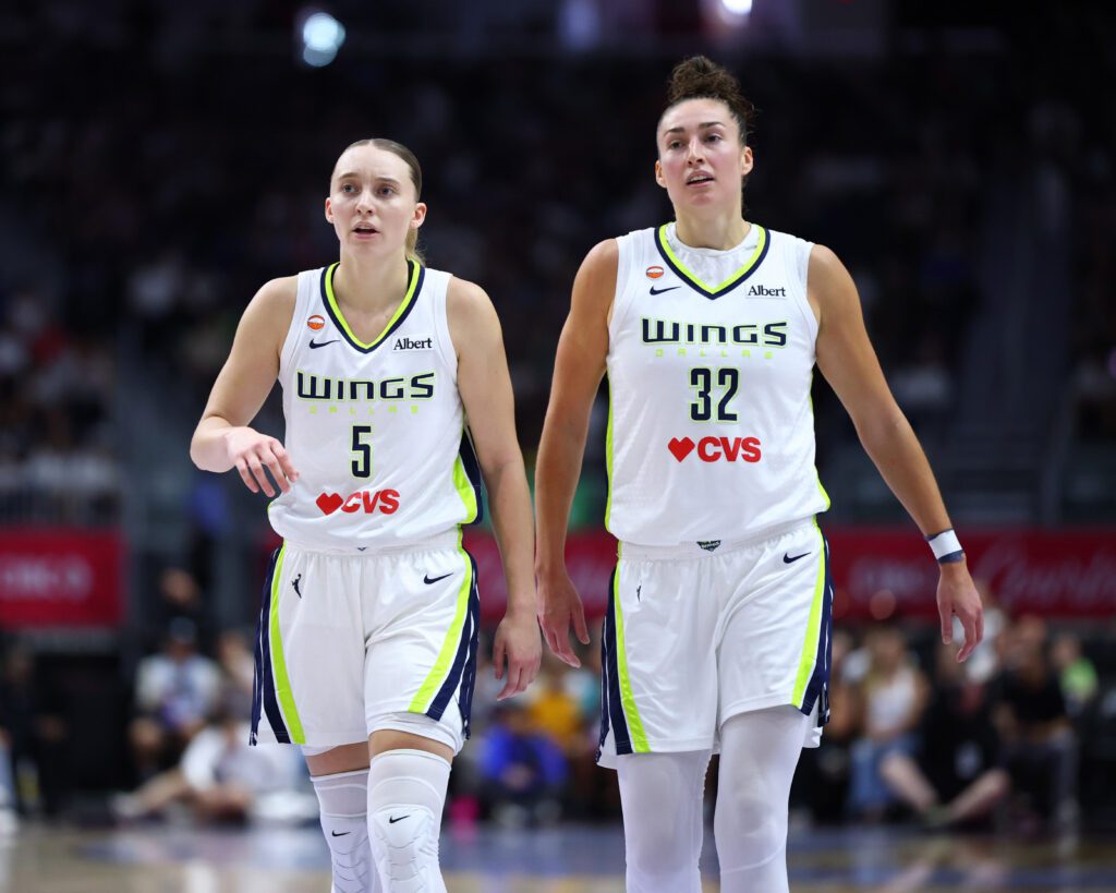 Paige Bueckers #5 and Jessica Shepard #32 of the Dallas Wings look on during the game against the Toronto Tempo.