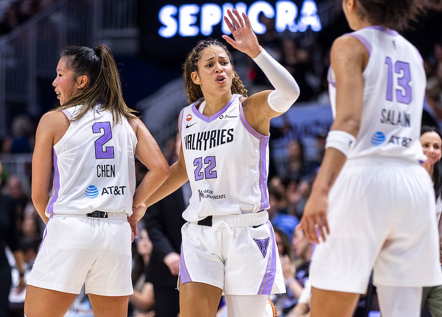 Veronica Burton #22 of the Golden State Valkyries celebrates a 83-75 win over the Toronto Tempo with teammates Kaitlyn Chen #2 and Janelle Salaun #13 after a WNBA game at Coca-Cola Coliseum