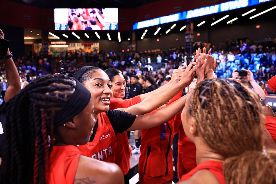 Angel Reese #5 and the Atlanta Dream celebrate after the game against the Los Angeles Sparks on July 13, 2026 at Gateway Center Arena at College Park in Atlanta, Georgia.