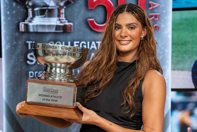 Lauren Betts, a senior basketball player from UCLA, holds 2026 Collegiate Woman Athlete of the Year Honda Cup trophy.